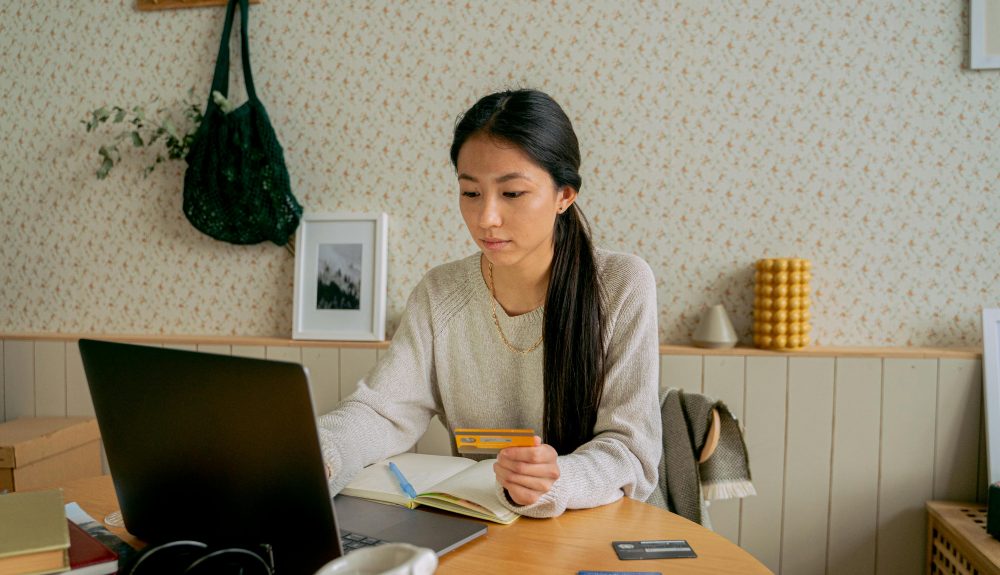 Consultant completing credit card payment for coretime subscription on a laptop, shown on pricing page.