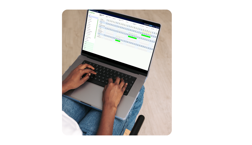 Man working from home using laptop on knees to view coretime leave chart dashboard for team availability planning.